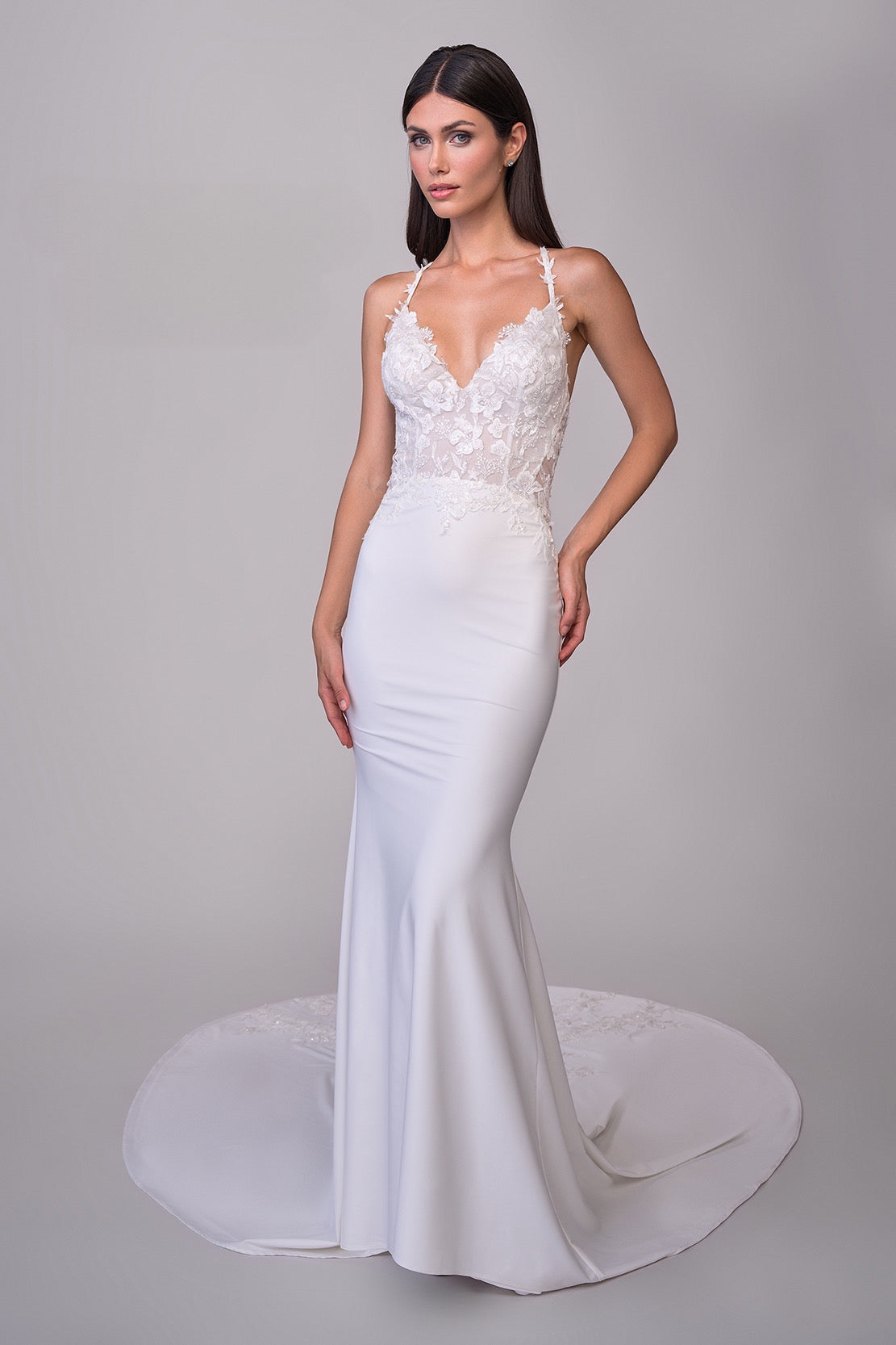 Joelle Oliva By La Femme J2165 Luna Bridal Gown - A luxurious jersey and lace bridal gown with an illusion back, lace applique bodice, and a sweeping train for a dramatic entrance.