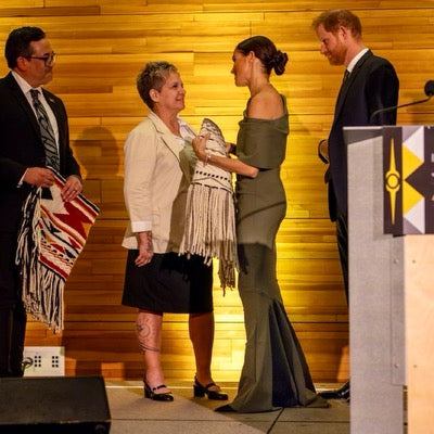 Meghan Markle attending a Invictus Games Gala with Prince Harry wearing the Oseph Gown.