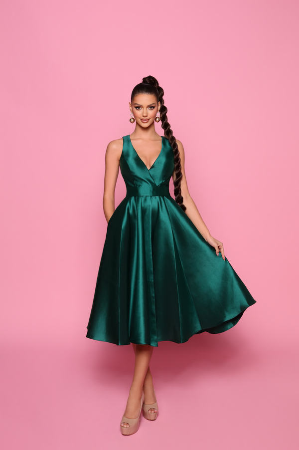 Nicoletta NP150 Midi-Length Mikado Cocktail Dress - A sophisticated A-line cocktail dress with a fitted waist, midi-length, and fully lined with pockets. Model is wearing the dress in emerald.
