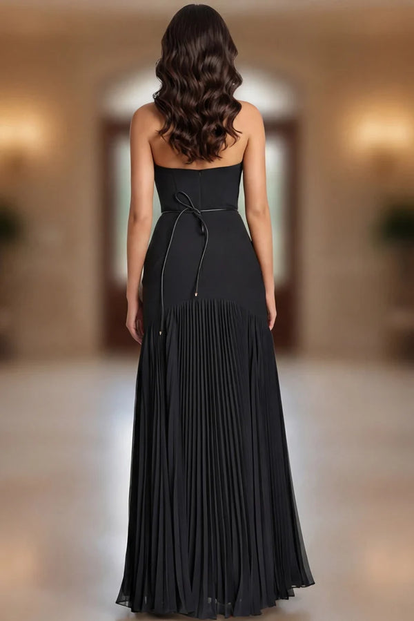 Model wearing Jovani 47000 strapless evening gown with floral waist detail and flowing pleated skirt.