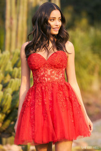 Strapless leaf lace cocktail dress by Sherri Hill with a sheer corset bodice, lace-up back, and tulle skirt. Ideal for cocktail parties, graduations, homecoming, and Bat Mitzvahs.