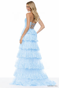Light blue lace evening gown with a tiered skirt on a white background