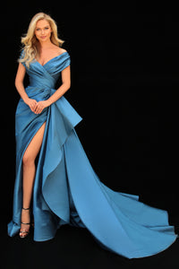 Shop the stunning Tarik Ediz 51121 dress from Madeline's. A captivating long column dress from the R2G collection, featuring a ruched design and crafted in luxurious taffeta. Perfect for evening special events and as mother of the bride or groom. Available at our Toronto and Boca Raton locations.