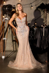 Woman in a sparkling evening gown standing in a stylishly decorated room with vintage equipment.