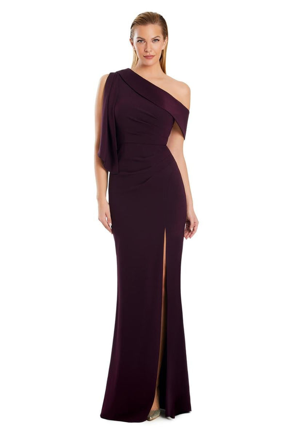 Model wearing Alexander by Daymor 3058S25 one-shoulder draped evening gown with pleated bodice, high side slit, and cascading detail.