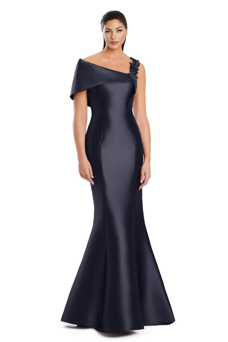 Model wearing Alexander by Daymor 3060S25 one-shoulder gown with draped back detail, fitted silhouette, and floor-length skirt.
