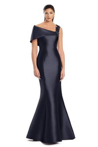 Model wearing Alexander by Daymor 3060S25 one-shoulder gown with draped back detail, fitted silhouette, and floor-length skirt.
