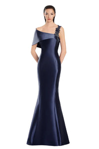 Model wearing Alexander by Daymor 3060S25 one-shoulder gown with draped back detail, fitted silhouette, and floor-length skirt.