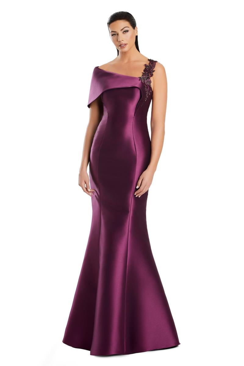 Model wearing Alexander by Daymor 3060S25 one-shoulder gown with draped back detail, fitted silhouette, and floor-length skirt.