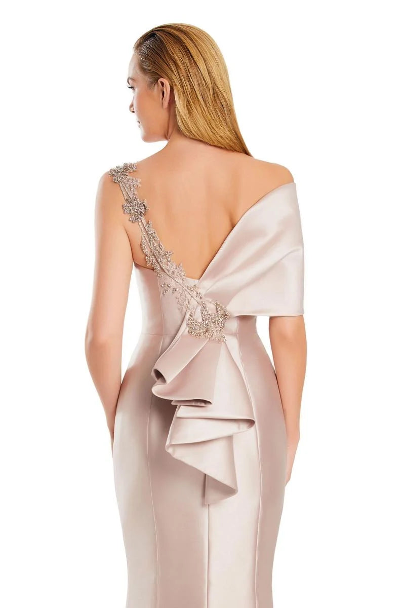 Model wearing Alexander by Daymor 3060S25 one-shoulder gown with draped back detail, fitted silhouette, and floor-length skirt.