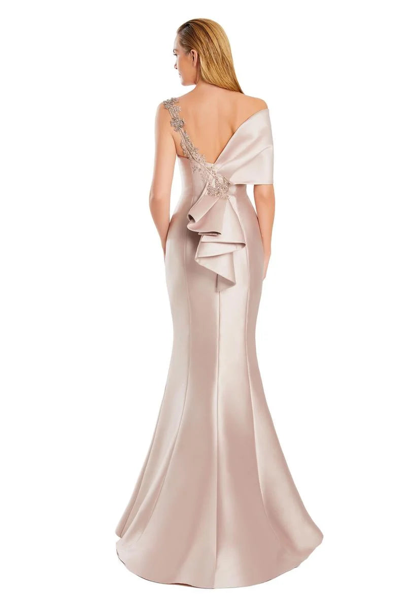 Model wearing Alexander by Daymor 3060S25 one-shoulder gown with draped back detail, fitted silhouette, and floor-length skirt.