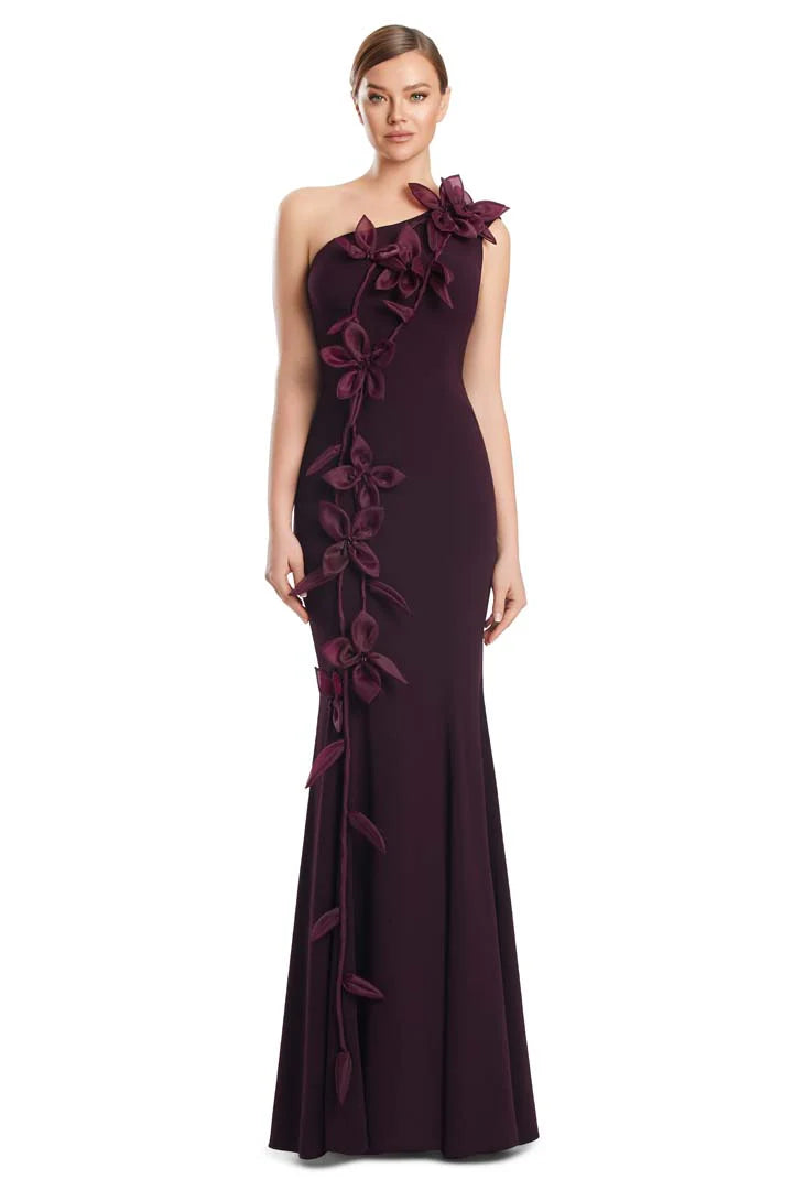 Model wearing Alexander by Daymor 3208S26 one-shoulder fitted gown with cascading floral appliqué detail.