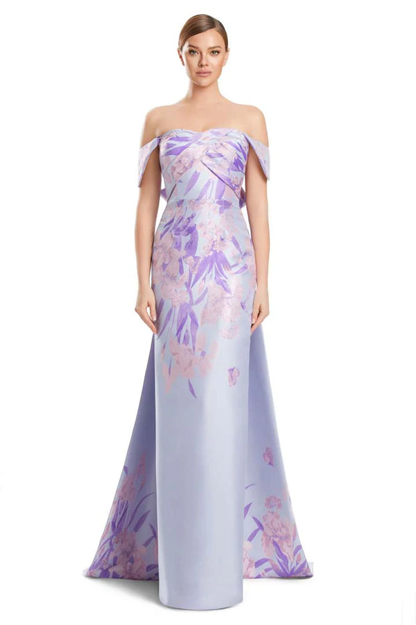 Woman wearing a purple floral off-shoulder gown on a white background
