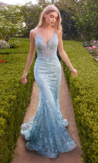 Andrea & Leo A1252 - An elegant spaghetti strap lace prom gown with a sheer corset bodice and scoop back, perfect for a graceful and sophisticated look. The model is wearing the dress in the color sea mist.