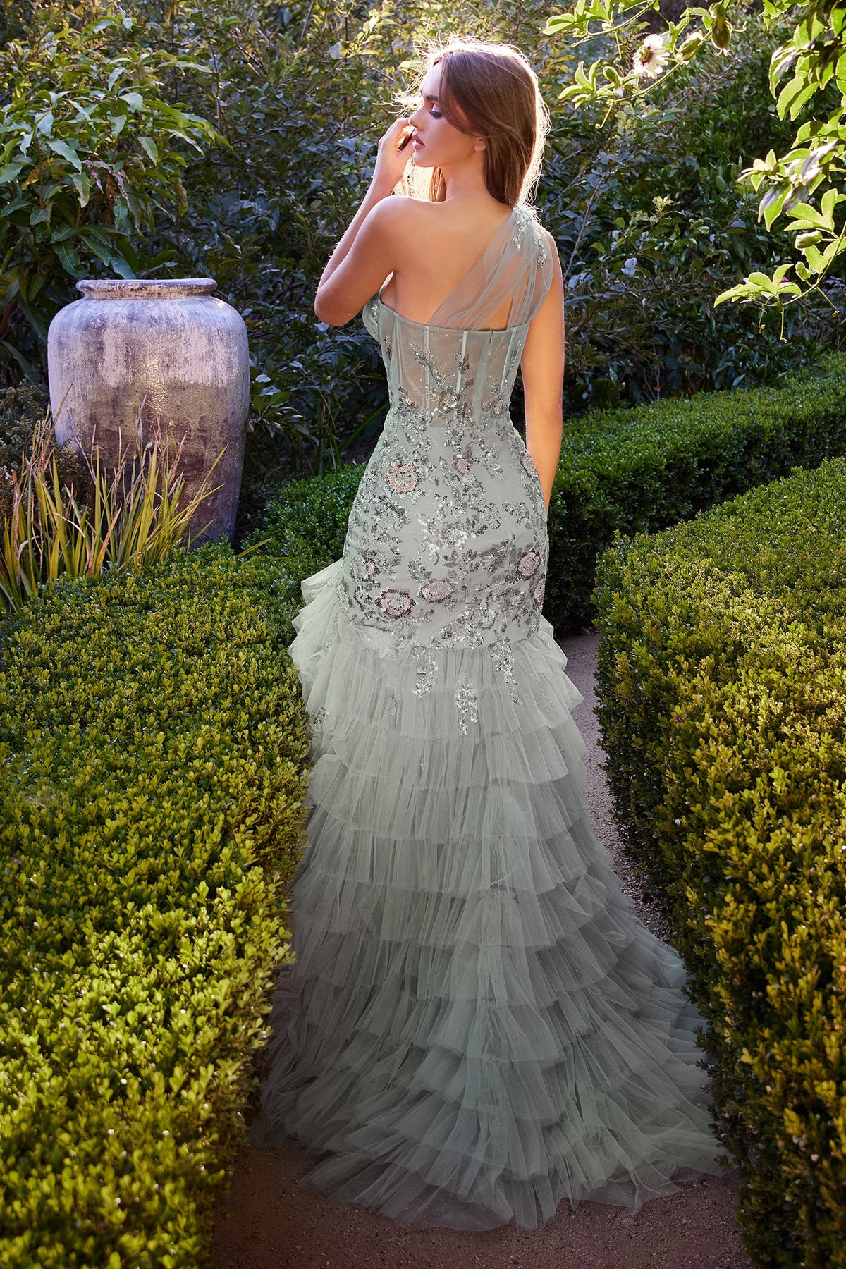 Andrea & Leo A1260 Enchanting Mermaid Prom Dress - A captivating mermaid prom dress with a sheer tulle one-shoulder strap, sequinned floral embellishments, and a tiered tulle skirt. Perfect for a magical and romantic prom night.