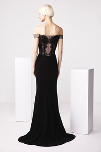 Model wearing Audrey+Brooks 6503 off-the-shoulder gown with sheer lace bodice and fit and flare silhouette.