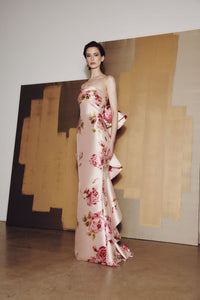 Model wearing Audrey+Brooks 6925 gown with draped bodice, fit and flare silhouette, and dramatic back ruffled train.