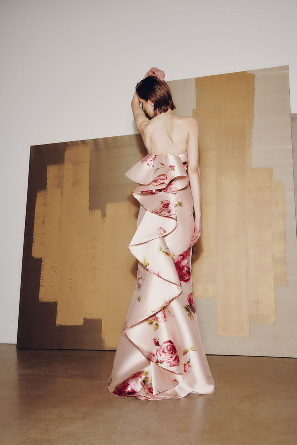 Model wearing Audrey+Brooks 6925 gown with draped bodice, fit and flare silhouette, and dramatic back ruffled train.