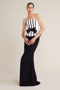 The Audrey+Brooks Strapless Corset Peplum Evening Gown in a full-length silhouette with a front bowknot detail. Perfect for formal evenings and mother of the bride or groom occasions.