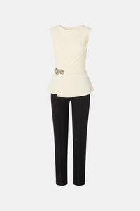 Shop the Chiara Boni SUZUE BIC BR ZP jumpsuit featuring a draped bodice, peplum waist, floral jewel detail and sleek tailored pants.