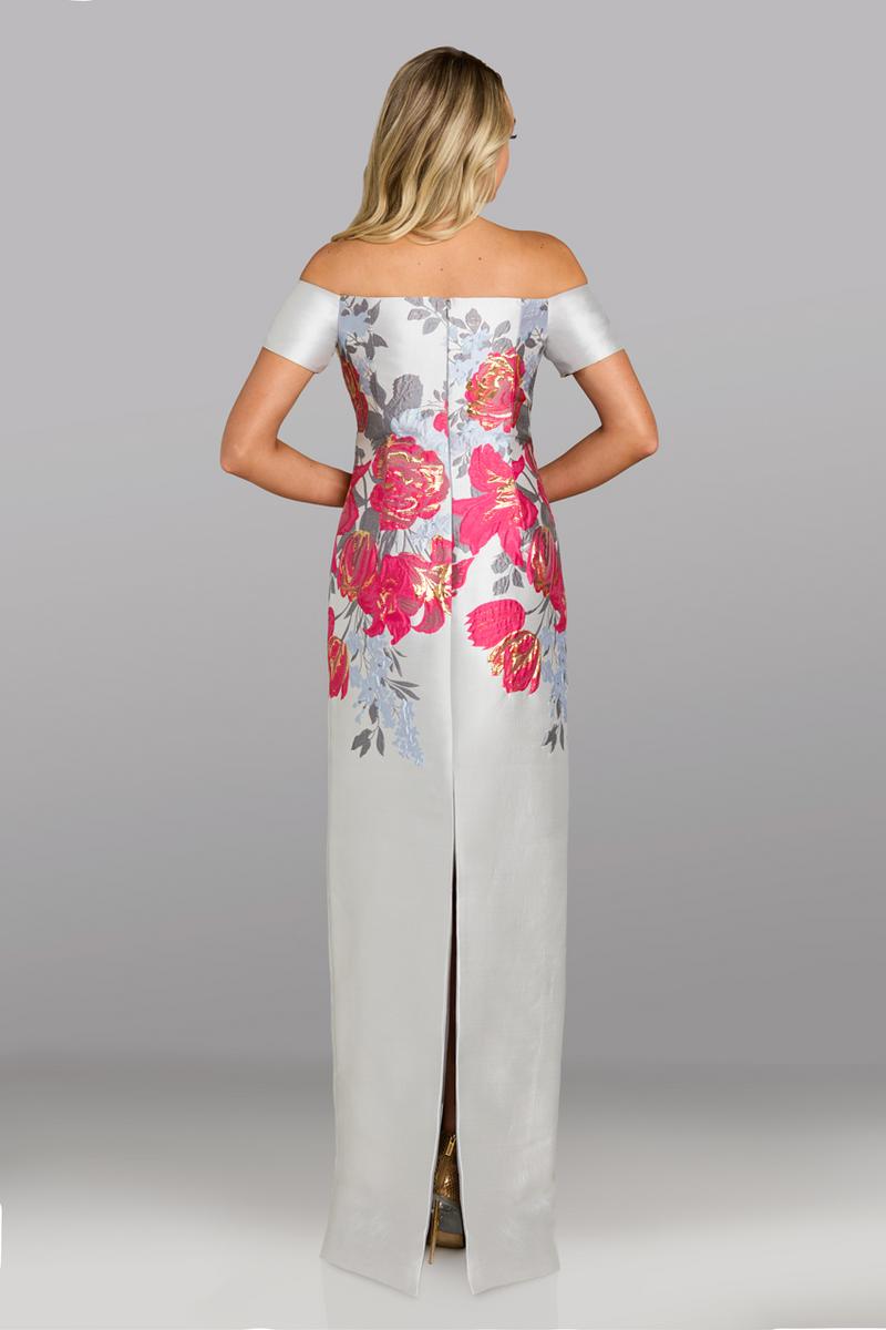 Model wearing Feriani Couture 18623 off-the-shoulder column gown with floral bodice detailing and a sleek, floor-length silhouette.