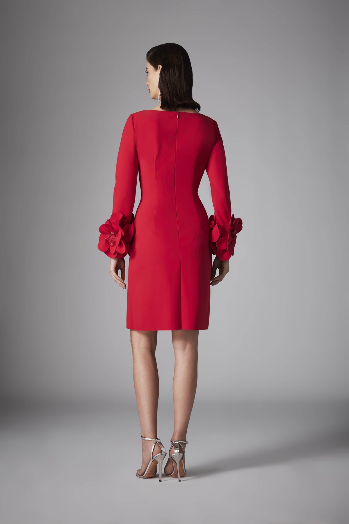 Model wearing Frascara 4525 dress with long sleeves, A-line silhouette, and 3D floral embellishments at the cuffs.