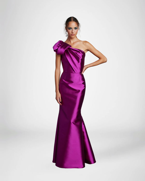 Frascara 4612 - A chic one-shoulder evening gown with an asymmetrical bow detail, perfect for formal evenings and mother of the bride or groom occasions. The model is wearing the dress in fuchsia. Front view.