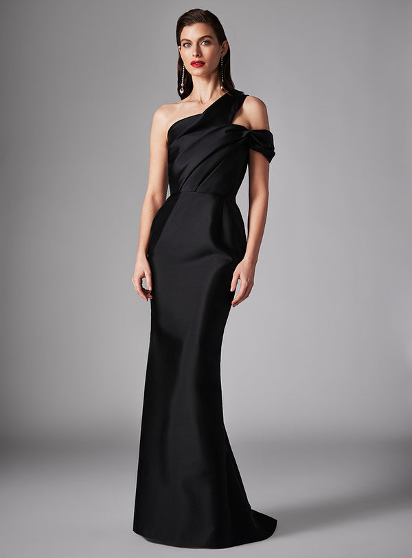 Embrace the allure of couture with this exquisite Frascara mermaid dress. Crafted from luxurious silk/wool, this one-shoulder, long silhouette design features a ruched bodice. Perfect for evening events and as Mother of the Bride or Groom. Available at Madeline's Boutique, Toronto & Boca Raton.