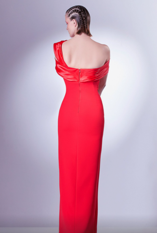 The Gaby Charbachy 1346 Elegant Draped Sleeve Evening Dress, featuring a fitted bodice, slim slit skirt, and captivating asymmetrical neckline with beautifully draped sleeves for a modern and sophisticated look.  This is a view of the back of the dress.