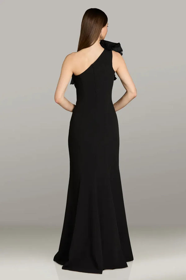 Model wearing Gia Franco 12563 one-shoulder gown with ruffle detail and floor-length silhouette, shown from front and back views.