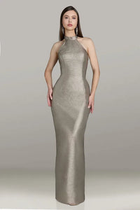 Model wearing Gia Franco 12564 halter column gown with crisscross back, button detail, and back slit.