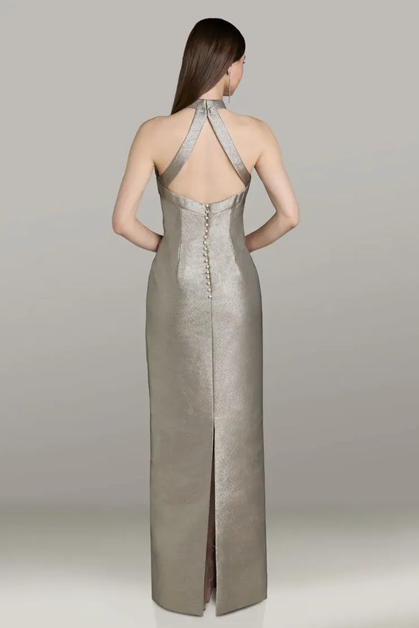 Model wearing Gia Franco 12564 halter column gown with crisscross back, button detail, and back slit.