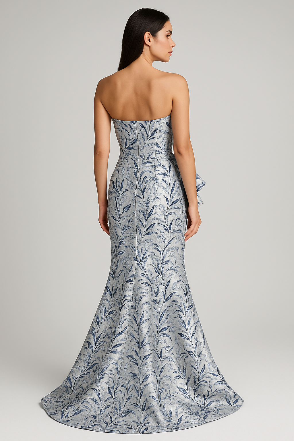 Model wearing Gia Franco 18507 strapless jacquard gown with swirl pattern and side ruffle detail.