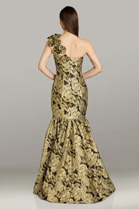 Model wearing Gia Franco 18552 one-shoulder mermaid gown with floral appliqué and flared skirt, back view showcasing elegant silhouette.
