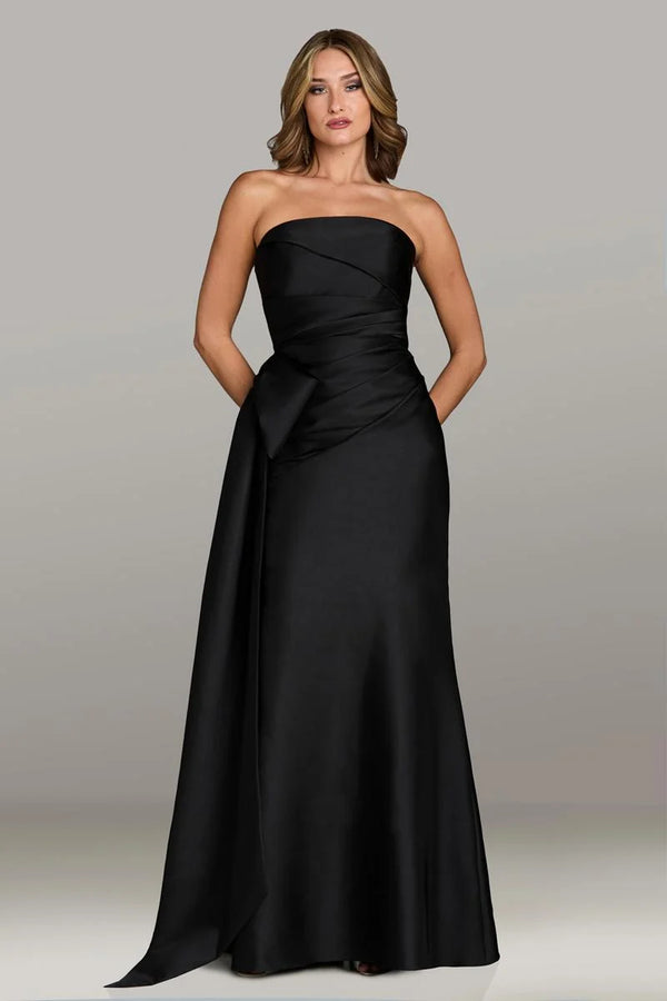 Gio Franco 12536 strapless gown with a draped bodice, side bow accent, and full-length silhouette. Ideal for formal evenings and weddings.  Model is wearing the color black.