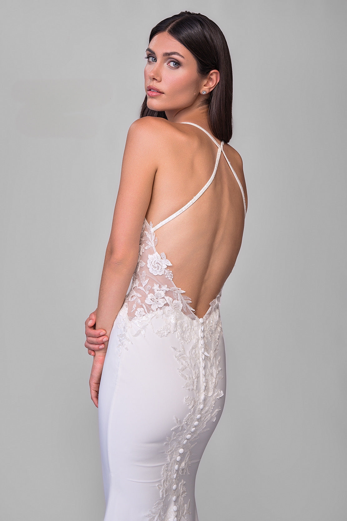 Joelle Oliva By La Femme J2165 Luna Bridal Gown - A luxurious jersey and lace bridal gown with an illusion back, lace applique bodice, and a sweeping train for a dramatic entrance.