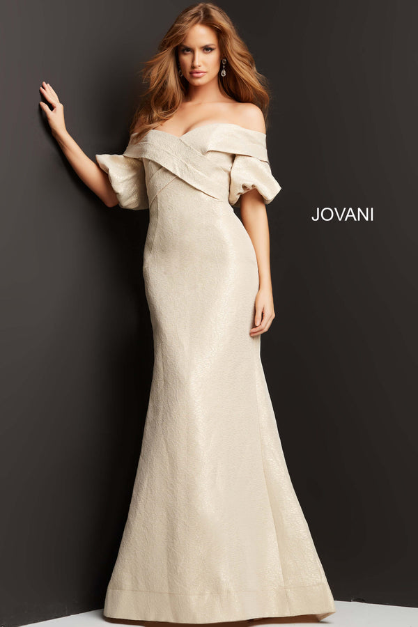 Model wearing Jovani 06831 off-the-shoulder puff sleeve mermaid gown with crossover bodice.
