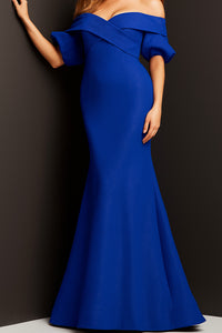 Model wearing Jovani 06831 off-the-shoulder puff sleeve mermaid gown with crossover bodice.