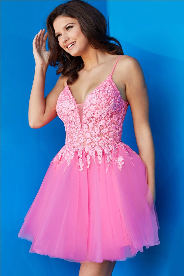 Jovani 08273 Floral Fit and Flare Cocktail Dress, a charming choice for homecoming or cocktail events. The dress features a floral bodice and a flattering fit-and-flare silhouette.  Picture is of the model wearing the dress in Hot Pink.