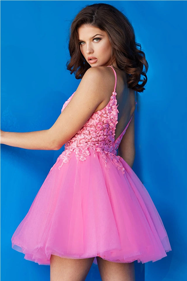 Jovani 08273 Floral Fit and Flare Cocktail Dress, a charming choice for homecoming or cocktail events. The dress features a floral bodice and a flattering fit-and-flare silhouette.  Picture is of the model wearing the dress in Hot Pink.