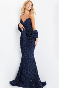 Model wearing Jovani 09768 lace appliqué mermaid gown with sweetheart neckline, matching shawl, and dramatic flared hem.  Model is wearing the color Navy.  Front View