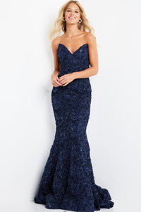Model wearing Jovani 09768 lace appliqué mermaid gown with sweetheart neckline, matching shawl, and dramatic flared hem.  Model is wearing the color Navy Front View.