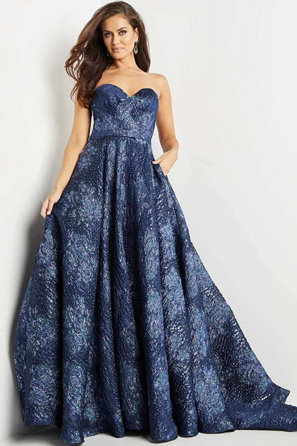 A woman wearing a strapless sweetheart A-line ballgown with a train, perfect for elegant evening occasions.