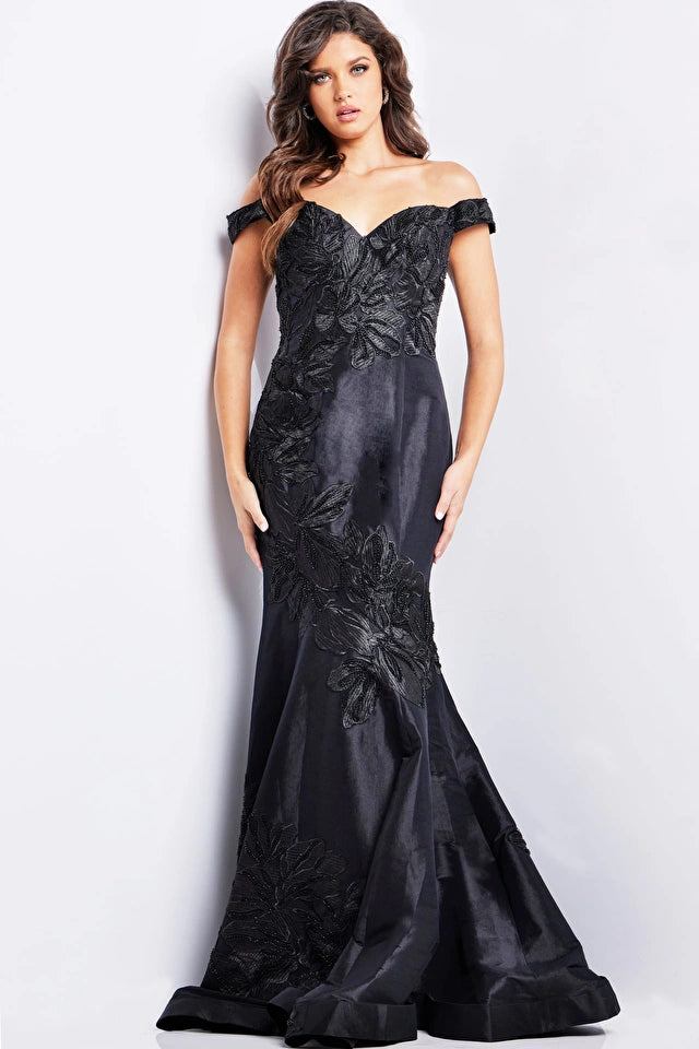 Jovani 23928 Black Floral Mermaid Evening Dress - An off-the-shoulder mermaid gown in classic black with intricate floral embroidery for a timeless and glamorous look at evening formal events.