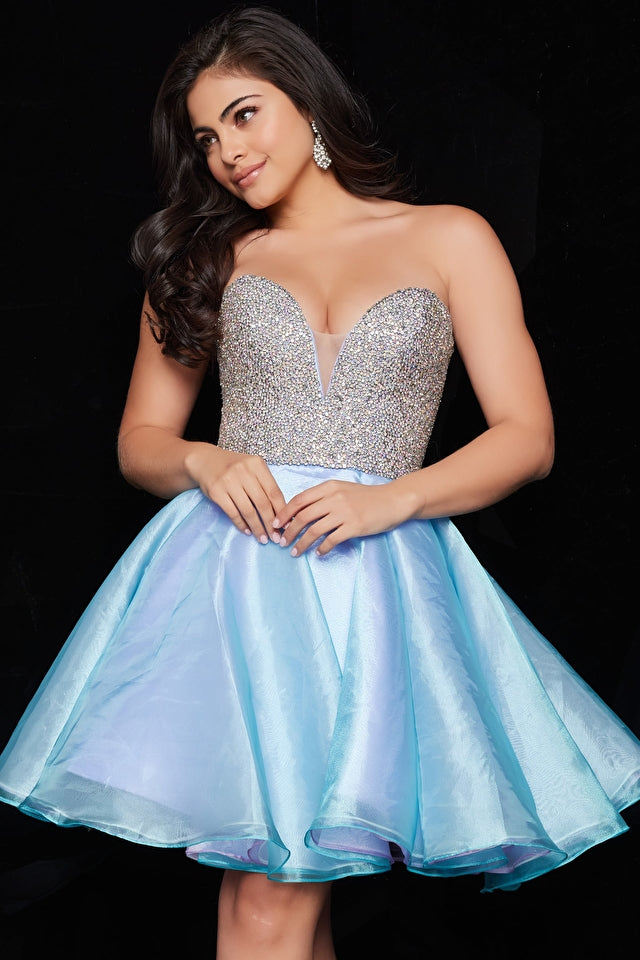Shop the stunning Jovani 24547 short cocktail dress at Madeline's Boutique. This sleeveless, strapless beauty features a beaded bodice and a flattering fit and flare silhouette. Made with luxurious taffeta and organza fabrics, it's the perfect choice for homecoming or bat mitzvah. Explore our Toronto and Boca Raton locations for the ultimate dress shopping experience.
