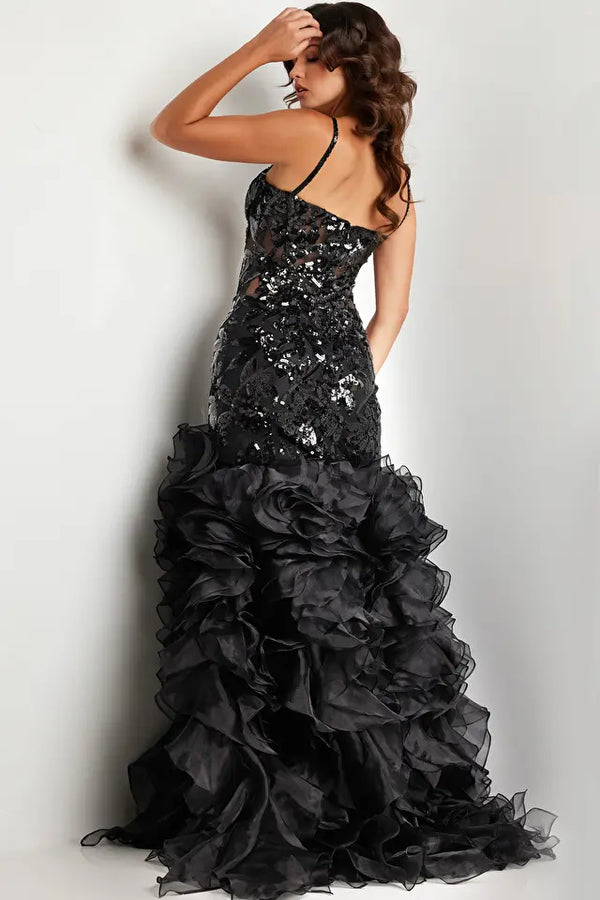 Jovani 38358 Sequin Embellished Mermaid Evening Gown - A glamorous gown featuring an organza ruffle skirt with a slit, sequin embellished bodice with boning and illusion waist, and a mermaid silhouette with a sweetheart neckline.  The model is showcasing the dress in black.