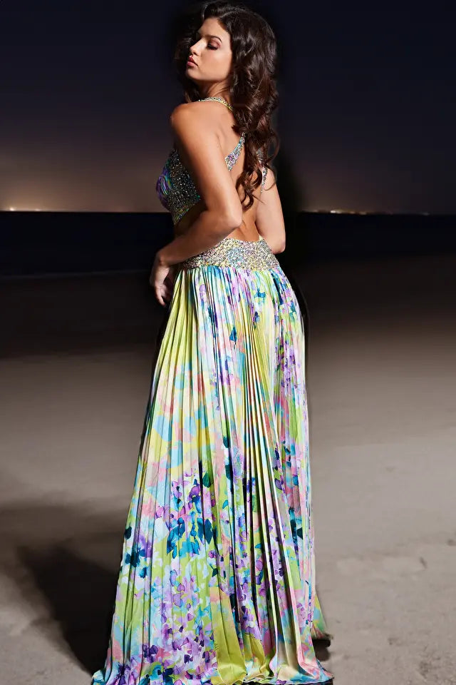 Jovani 38733 Floral Print Pleated Satin Gown - An enchanting floral print gown with a pleated skirt, high slit, embellished belt, and sweetheart neckline. Perfect for prom and evening formal events.