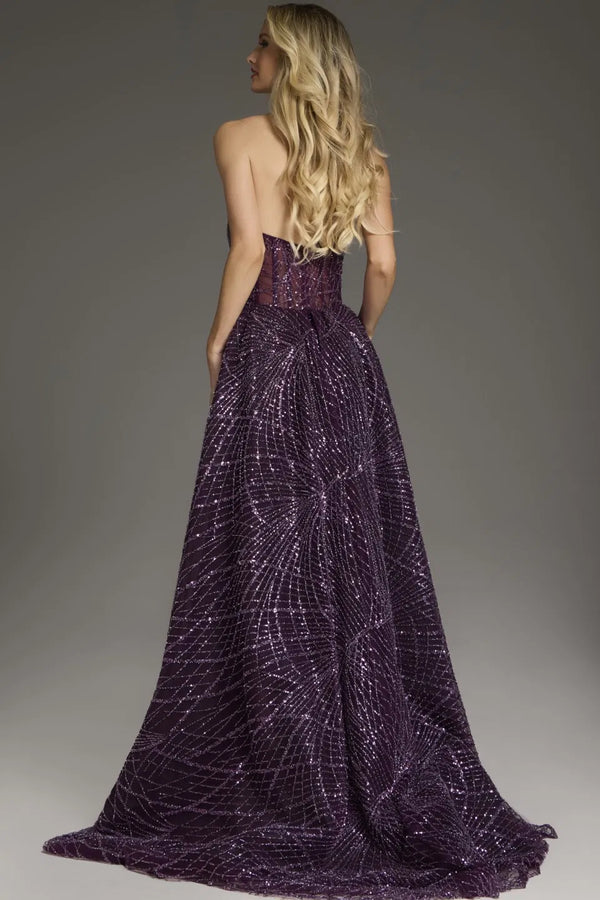 Model wearing Jovani 39029 strapless A-line gown with sequin embellishments and flowing overlay.