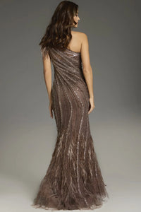 Woman wearing a one-shoulder, sequined evening gown against a neutral background