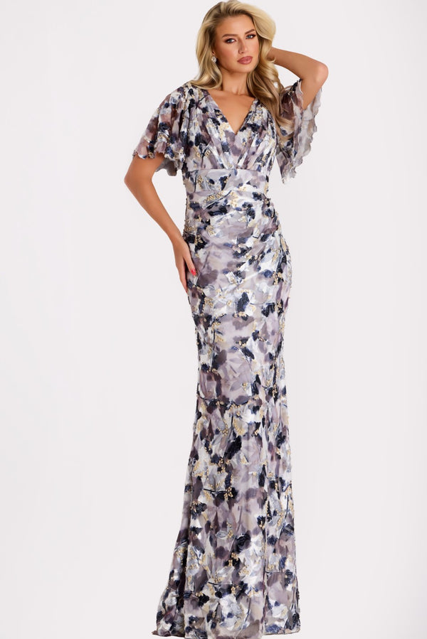 Model wearing Jovani 43046 sequin gown with flutter sleeves, V-neckline, and open back with tie detail.